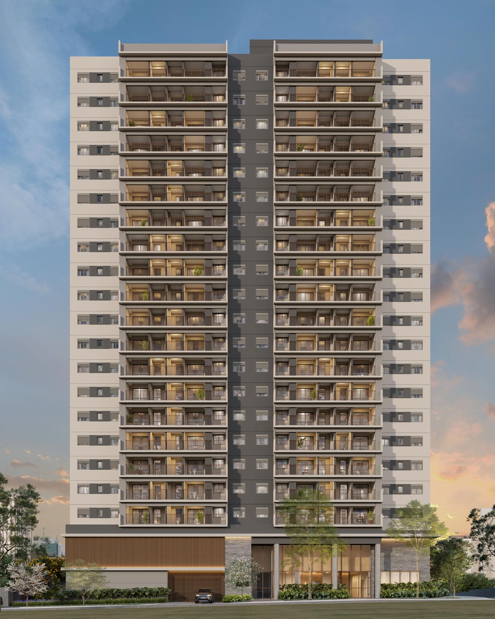 Fachada de edifício residencial moderno com varandas e iluminação noturna.